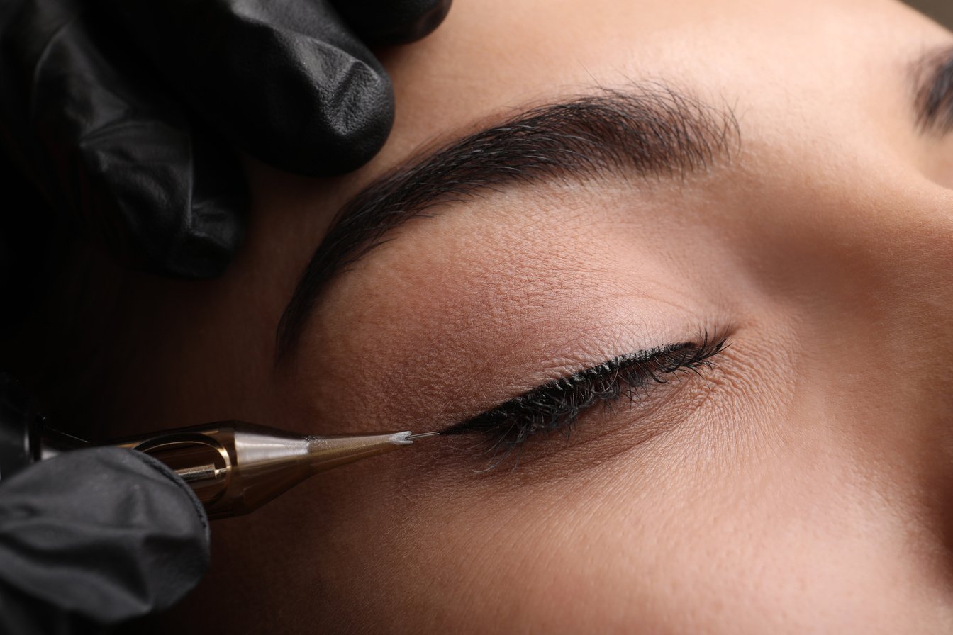 Young Woman Undergoing Procedure of Permanent Eye Makeup in Tatt